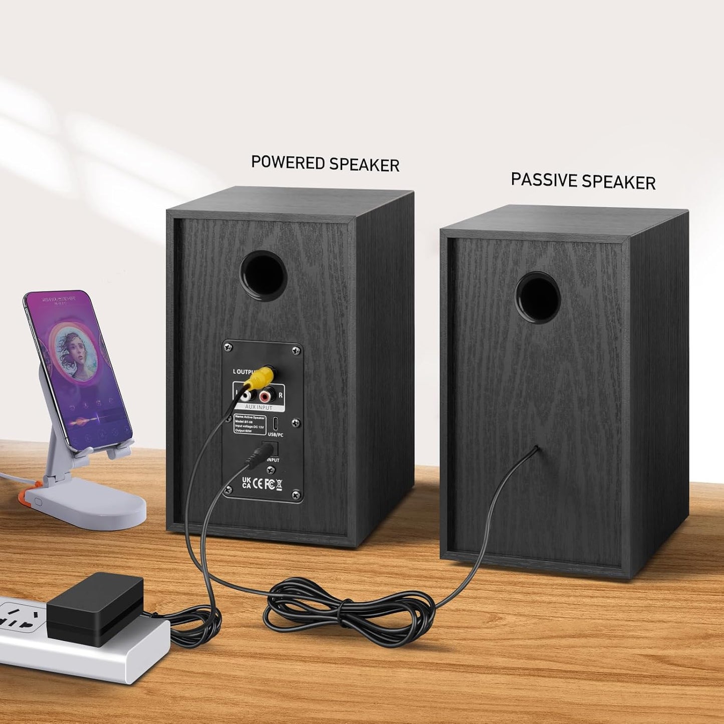 Powered speakers with volume control knobs